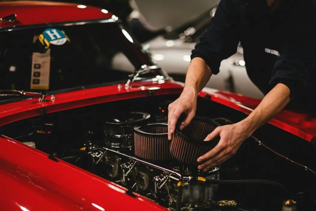 Car Freshener Spray: The Ultimate Guide to Febreze Car Air Freshener A mechanic replacing a car's air filter under the hood of a red classic car, ensuring better engine performance and fuel efficiency.